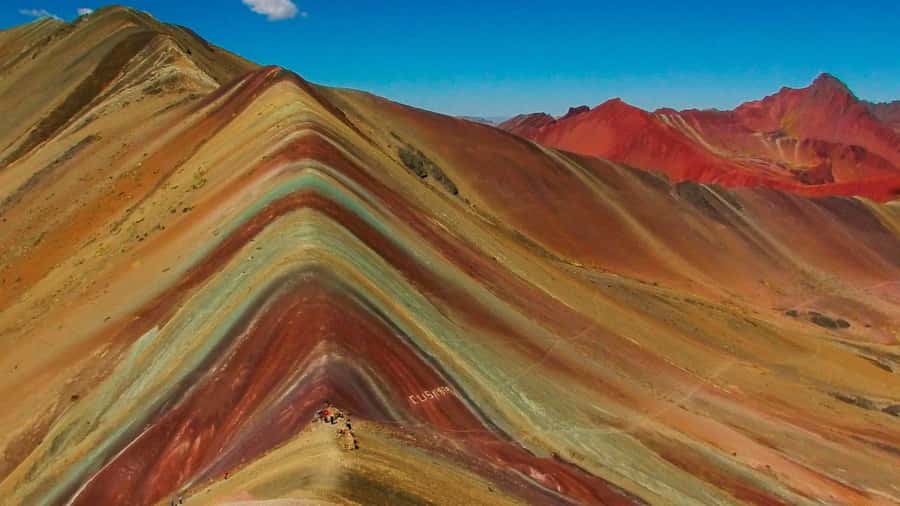 Cusco: Full-Day Rainbow Mountain & Red Valley Trekking Tour - The transfer between summits: 30 minutes to Red Valley