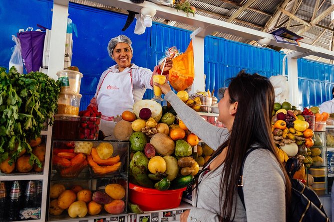 The 10 Tastings of Cusco With Locals: Private Food Tour - Mercado Central de San Pedro: Juice, Chocolate, and Big Corn